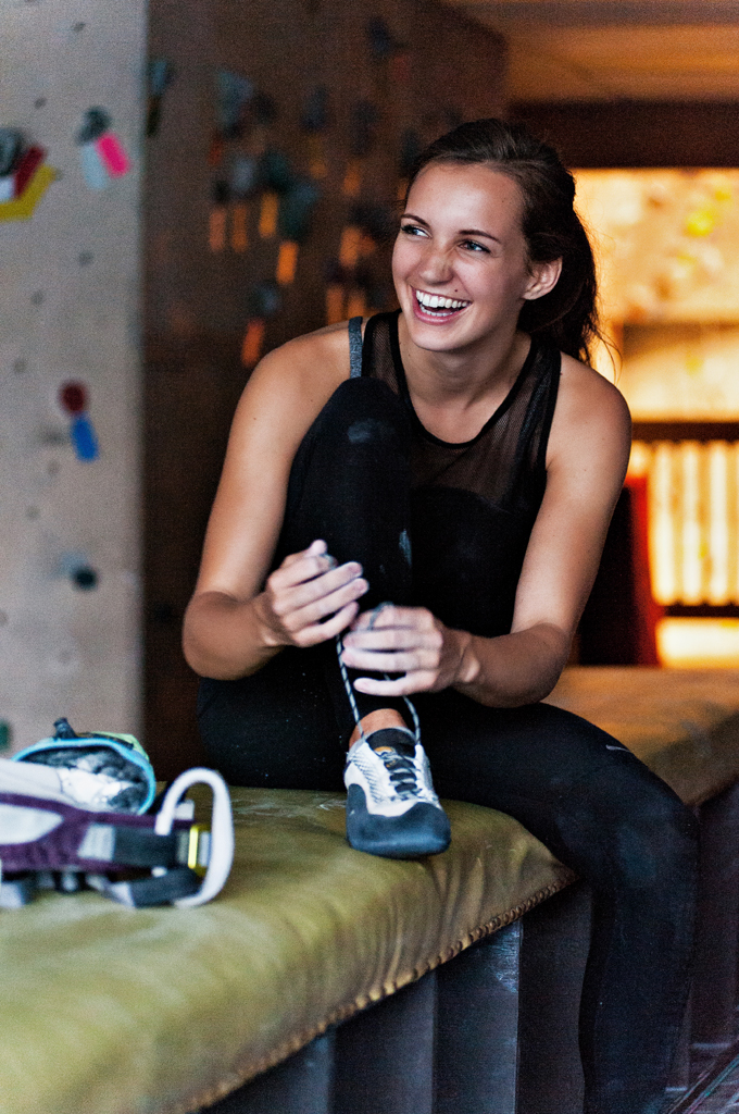 Fit women laces up her climbing shoes at an indoor climbing gym in Tulsa Oklahoma.

Kenneth M. Ruggiano is a photographer specializing in Sports and Fitness Photography based in Tulsa Oklahoma.